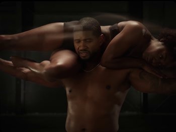 Movie still from “USHER, H.E.R. - Risk It All” (2024), directed by Dave Meyers – Medium shot, Over the shoulder angle