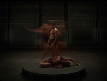 Movie still from “USHER, H.E.R. - Risk It All” (2024), directed by Dave Meyers – Wide shot, Low angle