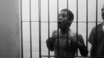 Movie still from “Vince Staples - Norf Norf” (2015), directed by Vince Staples – Medium shot, Low angle