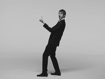 Movie still from “The Dare - Perfume” (2024), directed by Nick Harwood – Medium shot, Low angle