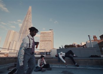 Movie still from “Sam Akpro - Death By Entertainment” (2023), directed by Pedro Takahashi – Extreme Wide shot, Low angle