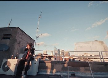 Movie still from “Sam Akpro - Death By Entertainment” (2023), directed by Pedro Takahashi – Extreme Wide shot, Low angle