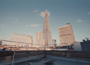 Movie still from “Sam Akpro - Death By Entertainment” (2023), directed by Pedro Takahashi – Extreme Wide shot, Low angle