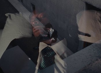 Movie still from “Sam Akpro - Death By Entertainment” (2023), directed by Pedro Takahashi – Extreme Close Up shot, Overhead angle
