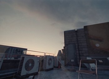 Movie still from “Sam Akpro - Death By Entertainment” (2023), directed by Pedro Takahashi – Extreme Wide shot, Low angle
