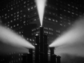 Movie still from “Manga Saint Hilare, MoreNight feat. P Money & JME - Alarm Bells” (2024), directed by Will Norman – Extreme Close Up shot, Low angle