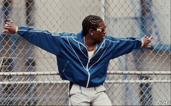 Movie still from “A$AP Rocky - D.M.B.” (2022), directed by A$AP Rocky – Medium shot, Low angle