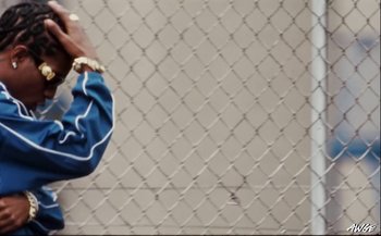 Movie still from “A$AP Rocky - D.M.B.” (2022), directed by A$AP Rocky – Close Up shot, Low angle