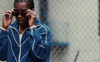 Movie still from “A$AP Rocky - D.M.B.” (2022), directed by A$AP Rocky – Close Up shot, Low angle