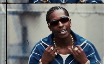 Movie still from “A$AP Rocky - D.M.B.” (2022), directed by A$AP Rocky – Close Up shot, Low angle