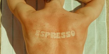 Movie still from “Sabrina Carpenter - Espresso” (2024), directed by Dave Meyers – Extreme Close Up shot, Overhead angle