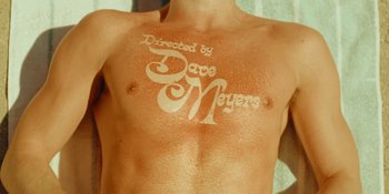 Movie still from “Sabrina Carpenter - Espresso” (2024), directed by Dave Meyers – Extreme Close Up shot, Overhead angle