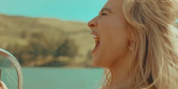 Movie still from “Sabrina Carpenter - Espresso” (2024), directed by Dave Meyers – Close Up shot, Low angle