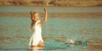 Movie still from “Sabrina Carpenter - Espresso” (2024), directed by Dave Meyers – Wide shot, Over the shoulder angle
