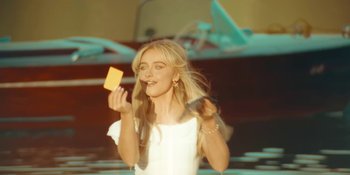 Movie still from “Sabrina Carpenter - Espresso” (2024), directed by Dave Meyers – Medium shot, Low angle
