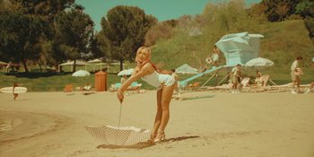 Movie still from “Sabrina Carpenter - Espresso” (2024), directed by Dave Meyers – Wide shot, Low angle