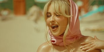 Movie still from “Sabrina Carpenter - Espresso” (2024), directed by Dave Meyers – Close Up shot, Low angle