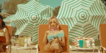 Movie still from “Sabrina Carpenter - Espresso” (2024), directed by Dave Meyers – Medium shot, Low angle