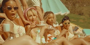 Movie still from “Sabrina Carpenter - Espresso” (2024), directed by Dave Meyers – Medium shot, High angle