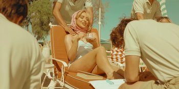 Movie still from “Sabrina Carpenter - Espresso” (2024), directed by Dave Meyers – Medium shot, Low angle