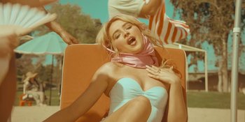 Movie still from “Sabrina Carpenter - Espresso” (2024), directed by Dave Meyers – Medium shot, Low angle