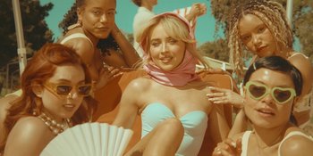 Movie still from “Sabrina Carpenter - Espresso” (2024), directed by Dave Meyers – Medium shot, Low angle