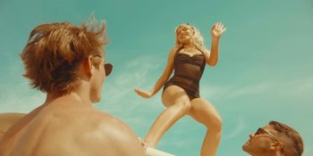Movie still from “Sabrina Carpenter - Espresso” (2024), directed by Dave Meyers – Medium shot, Low angle