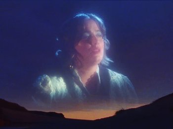 Movie still from “Metronomy & Katy J Pearson's - Love Factory” (2022), directed by Ned Botwood – Close Up shot, Low angle