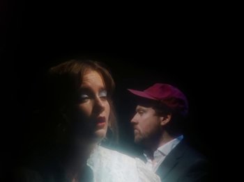 Movie still from “Metronomy & Katy J Pearson's - Love Factory” (2022), directed by Ned Botwood – Medium shot, Low angle