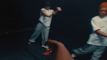 Movie still from “Downtown Kayoto - Came Thru” (2024), directed by Joe Howat – Medium shot, High angle