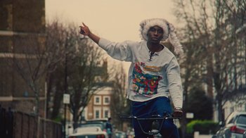 Movie still from “Downtown Kayoto - Came Thru” (2024), directed by Joe Howat – Medium shot, Low angle