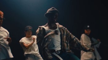 Movie still from “Downtown Kayoto - Came Thru” (2024), directed by Joe Howat – Medium shot, Low angle