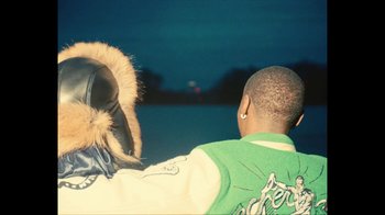 Movie still from “Downtown Kayoto - Came Thru” (2024), directed by Joe Howat – Medium shot, Over the shoulder angle