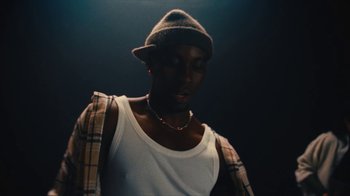 Movie still from “Downtown Kayoto - Came Thru” (2024), directed by Joe Howat – Medium shot, Low angle