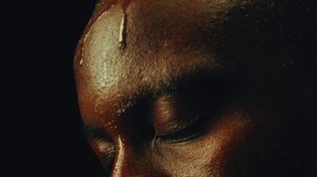 Movie still from “Downtown Kayoto - Came Thru” (2024), directed by Joe Howat – Extreme Close Up shot, High angle