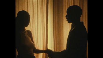 Movie still from “Downtown Kayoto - Came Thru” (2024), directed by Joe Howat – Medium shot, Over the shoulder angle