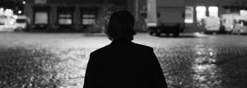 Movie still from “Empimic - Bittere Welt” (2021), directed by Angelo Kovatchev – Medium shot, Over the shoulder angle