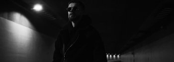 Movie still from “Empimic - Bittere Welt” (2021), directed by Angelo Kovatchev – Close Up shot, Low angle