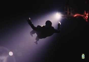 Movie still from “Sheck Wes, JID & Ski Mask The Slump God - Fly Away” (2024), directed by Cole Bennett – Wide shot, Low angle