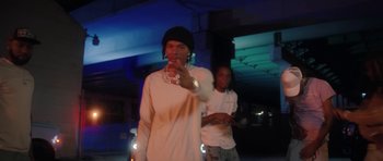 Movie still from “SleazyWorld Go ft. Lil Baby - Sleazy Flow” (2022), directed by Louie Knows – Medium shot, Low angle