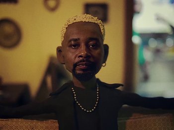 Movie still from “Danny Brown feat. Bruiser Wolf - Y.B.P.” (2024), directed by Edem Wornoo – Close Up shot, Low angle