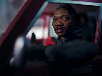 Movie still from “Danny Brown feat. Bruiser Wolf - Y.B.P.” (2024), directed by Edem Wornoo – Close Up shot, Low angle