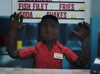 Movie still from “Danny Brown feat. Bruiser Wolf - Y.B.P.” (2024), directed by Edem Wornoo – Medium shot, Overhead angle