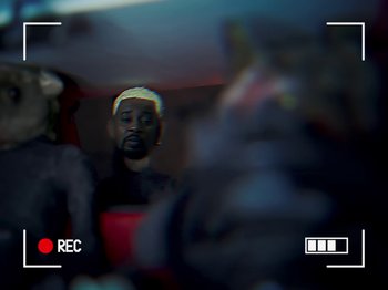 Movie still from “Danny Brown feat. Bruiser Wolf - Y.B.P.” (2024), directed by Edem Wornoo – Extreme Close Up shot, Over the shoulder angle