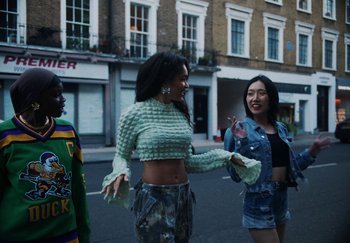 Movie still from “AJ Tracey - Bubble Bath” (2024), directed by Late Milk – Medium shot, Low angle