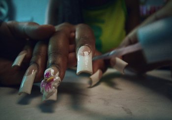 Movie still from “AJ Tracey - Bubble Bath” (2024), directed by Late Milk – Extreme Close Up shot, Low angle