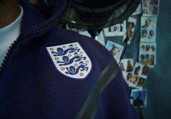 Movie still from “AJ Tracey - Bubble Bath” (2024), directed by Late Milk – Extreme Close Up shot, High angle