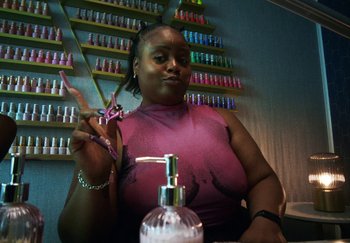 Movie still from “AJ Tracey - Bubble Bath” (2024), directed by Late Milk – Close Up shot, High angle