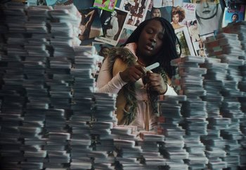 Movie still from “AJ Tracey - Bubble Bath” (2024), directed by Late Milk – Medium shot, High angle