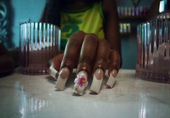 Movie still from “AJ Tracey - Bubble Bath” (2024), directed by Late Milk – Extreme Close Up shot, Low angle